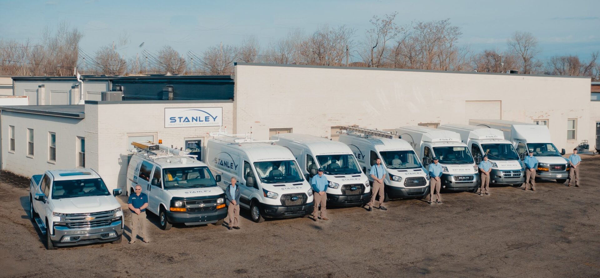Stanley Heating Cooling & Plumbing team with service vans